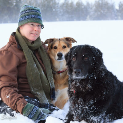 Erin, Greta, and Shadow pose for a family picture.