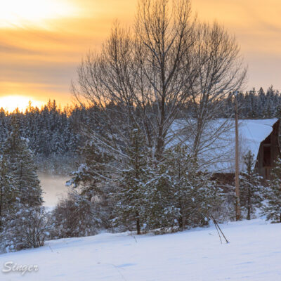 This is our neighbor's barn in view as the sun sets behind the hill.